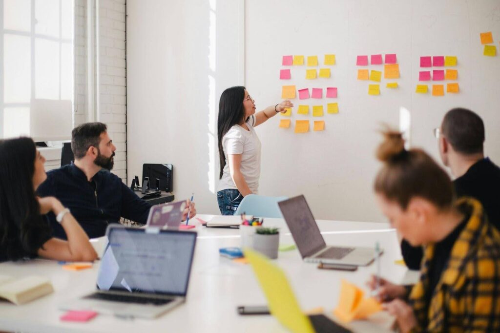 Team brainstorming with sticky notes during company formation planning