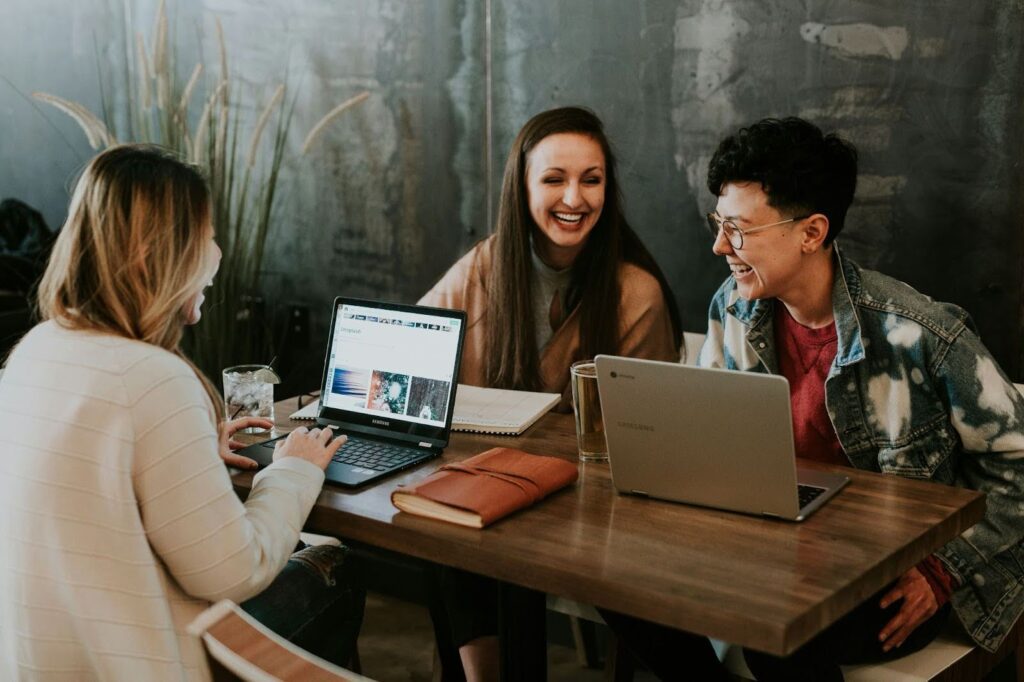 Team collaborating with laptops to streamline business operations
